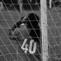 NCU goalkeeper refuels with a quick sip as the match heats up.